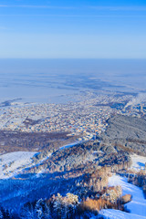 View from Tserkovka mountain to the resort town of Belokurikha in winter, Altai, Russia