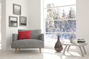 White room with armchair and winter landscape in window. Scandinavian interior design. 3D illustration