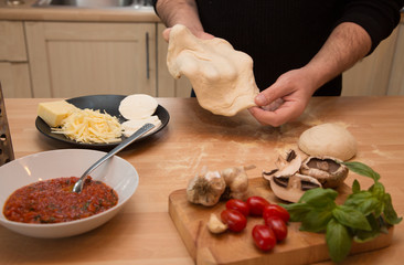 Making homemade pizza with fresh ingredients