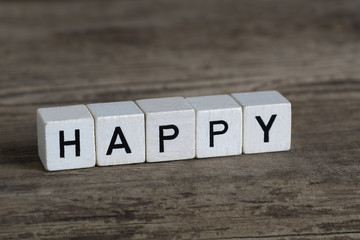 Happy, written in cubes