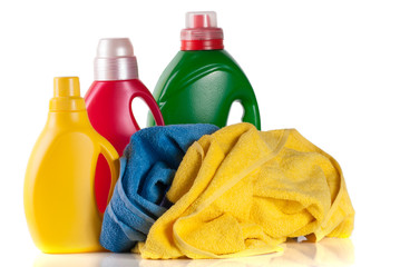 bottle laundry detergent and conditioner with towels isolated on white background