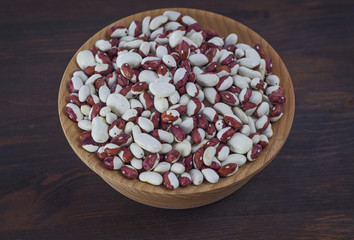 White beans in a wooden bowl