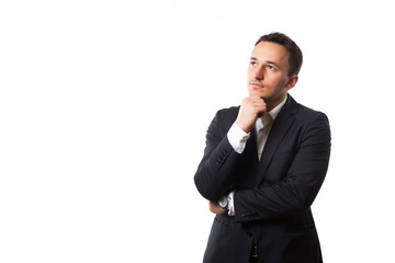 young man in a suit on a white background thinking