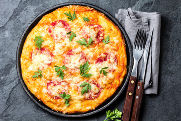 Pizza with salami decorated with parsley. Top view