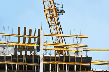Crane and highrise construction site