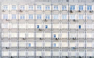 facade of a residential building with symmetrically arranged lotswindows