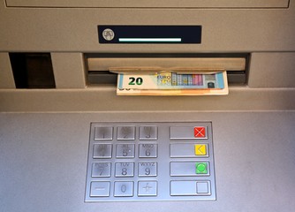 electronic keyboard of an ATM with money