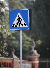 road sign warning pedestrian crossing