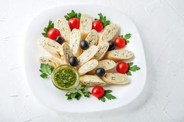Pancake with feta cheese and herbs and pesto. Top view. The concept of healthy eating and vegetarianism.
