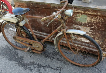 Old rusty moped like bike with motor engine