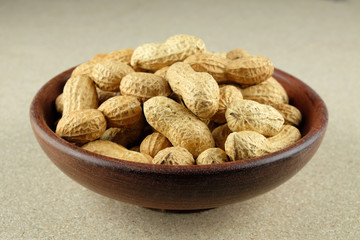 Peanuts in a wooden bowl.