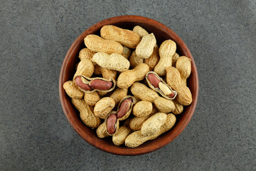 Peanuts in a wooden bowl.