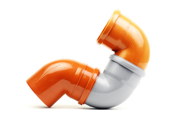 New grey and orange drain pvc pipe isolated on white