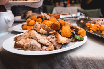 roasted meat with vegetables on a plate