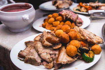 roasted meat with vegetables on a plate