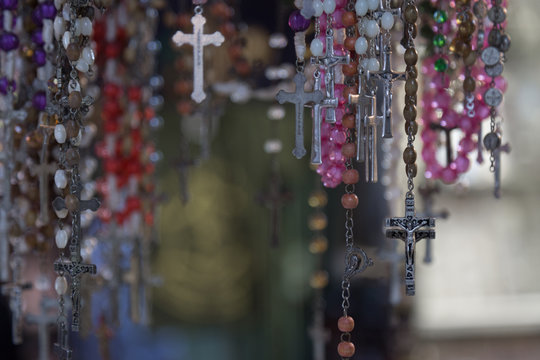 Christian Cross And Rosary Colorful Background.