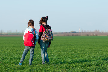 two girls,travel with a backpack