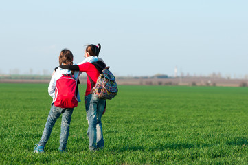 two girls,travel with a backpack