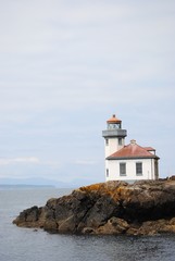 Fototapeta na wymiar Lighthouse on a cliff. San Juan and Orcas Islands. US Pacific North West.