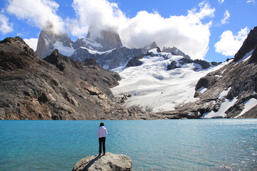 Girl, blue lake, glacier and mountains. El Chalten (Argentina's Trekking Capital) - Patagonia