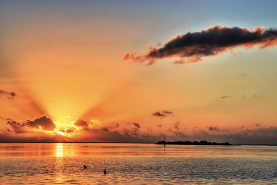 Amazing sunset on the beach of Moorea, French Polynesia. HDR (High dynamic range) picture.