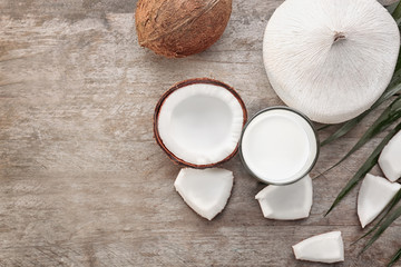 Fototapeta na wymiar Composition with fresh coconut milk on wooden background
