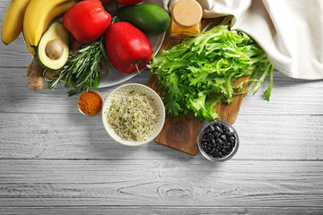 Set of healthy products on white wooden background