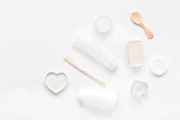white cosmetic set on desk background top view mock up