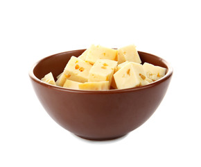 Bowl with delicious coriander cheese on white background