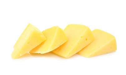 Delicious pieces of cheese on white background