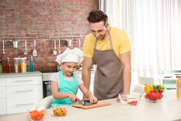 Dad and son cooking at home