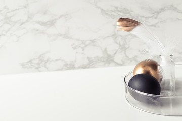 Obraz premium Easter decorations in the style of minimalism with golden and black eggs