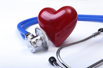 Medical stethoscope and red heart isolated on white background.