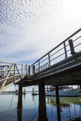 Marina footbridge over blue cloudy sky, Spain