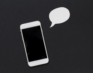 White phone with blank text bubble. Smartphone and cartoon style bubble.