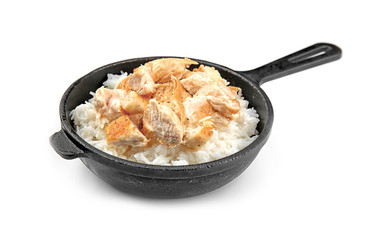 Frying pan with chicken and rice on white background
