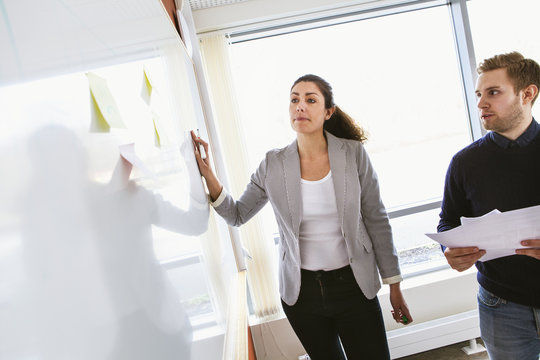 Sweden, People sharing ideas during work meeting