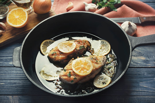 Delicious chicken breasts in frying pan