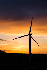 Windmill silhouette at sunset