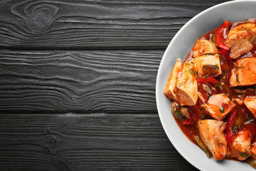 Plate with chicken cacciatore on kitchen table