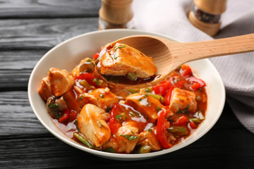 Plate with chicken cacciatore on kitchen table