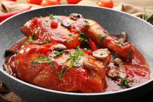 Frying pan with chicken cacciatore, closeup
