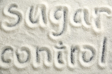 Written text SUGAR CONTROL on dark background