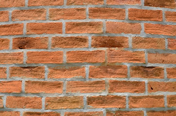 Brown bricks are constructing the wall