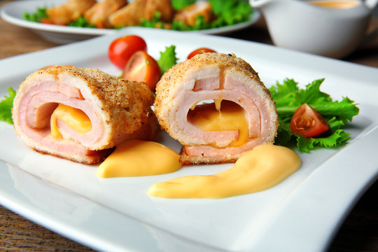 Plate with tasty chicken sliced roll, closeup