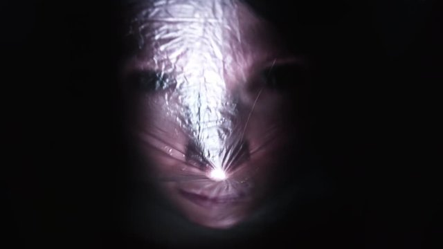 4K Horror Shot Of Woman Being Asphyxiated with Plastic Bag