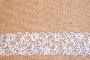 background - natural color burlap hessian with white lace border
 - obrazy, fototapety, plakaty