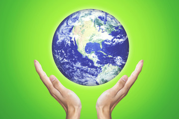 Male hands holding globe