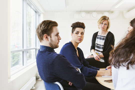 Sweden, Young people sharing ideas during board meeting