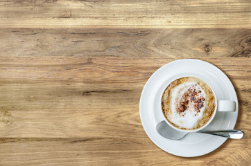 Top view cup of coffee on wooden table.